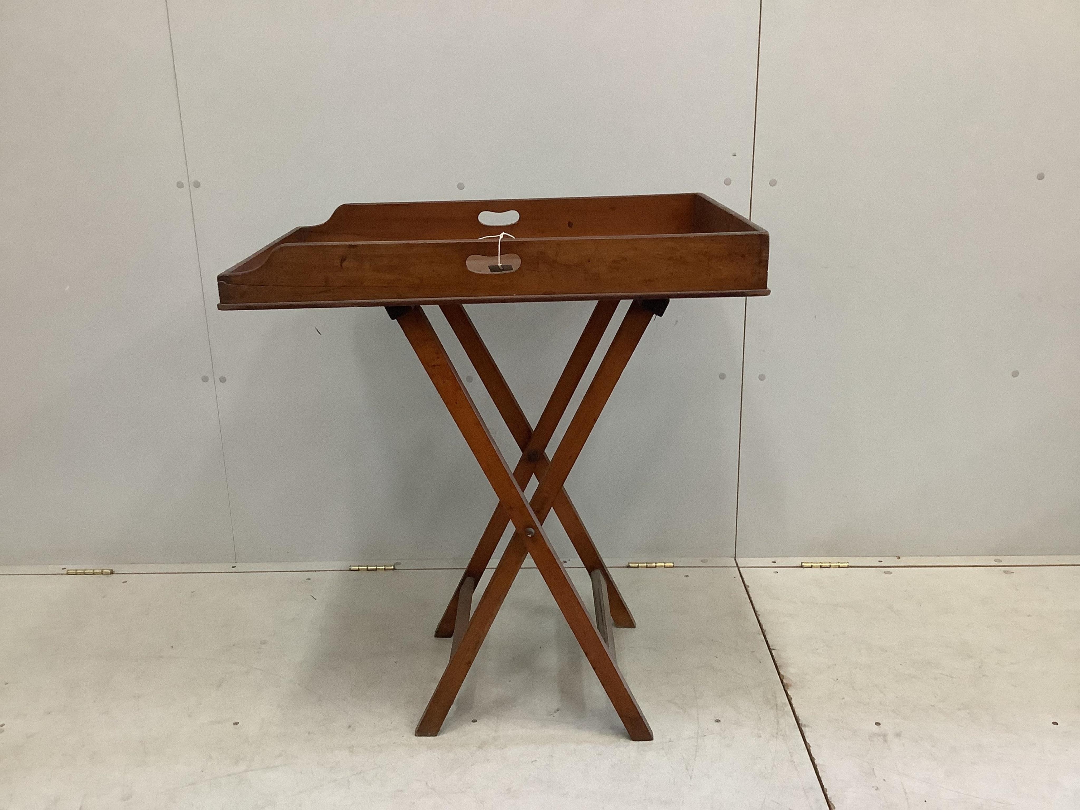 A Victorian rectangular mahogany butler's tray on folding stand, width 78cm, depth 52cm, height 90cm. Condition - fair